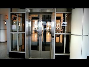 1980s Montgomery-KONE hydraulic glass elevators @ Montreal Trudeau Airport (YUL)