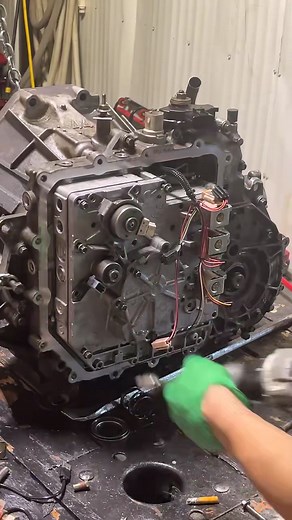 Ford taurus auto transmission rebuild. The round things are your solenoids! They click to change hydraulic fluid routing to push different gears together when your car wants to shift gears in an automatic. #ford #transmission #mechanics.