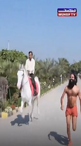 35K views · 119 reactions | Baba Ramdev Races a Horse at 59, Viral Fitness Video Yoga guru Baba Ramdev, known for his fitness, shared a video of himself running alongside a horse. The video showcases his impressive speed and endurance, sparking reactions online. #BabaRamdev #Fitness #Yoga #Viral #India #HorseRacing #Inspiration #Sports | MUNSIF TV INDIA | Facebook