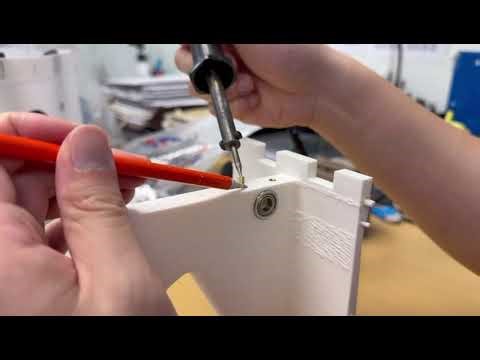 "Heat-staking M3 copper threaded inserts into a 3D-printed module."