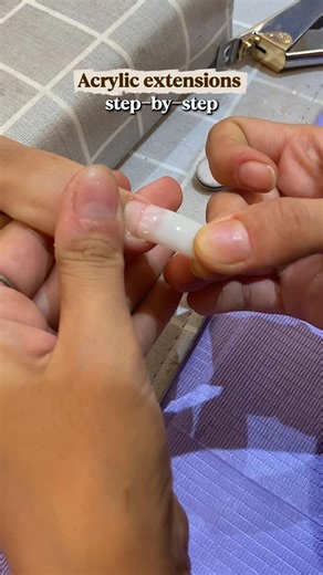 Timeless Nails on Instagram: "Creating flawless acrylic extensions is all about balance, precision, and understanding how each bead shapes the nail. The process begins with selecting the right nail tip and ensuring it blends perfectly with the natural nail. Once the foundation is ready, acrylic application starts slow, controlled, and seamless. First Bead – Centre Placement: The first bead is always applied at the centre of the nail, right on the merging line, where half of the nail extension ti