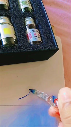 Writing the word "r" in caligraphy using glass pen ❤️