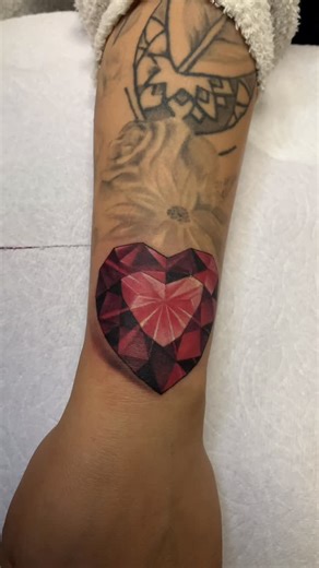Chaq D. Lobaton on Instagram: "A cover-up tattoo of ruby for Julie. She really sat like a rock #coveruptattoo #rubystonered #realistictattoos #coloredtattoo #tattoochaq"