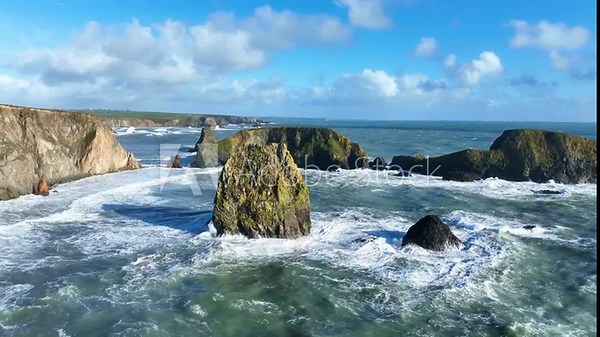 Wild Ireland drone circling sea stack in Atlantic winter storm Copper Coast Waterford epic locations