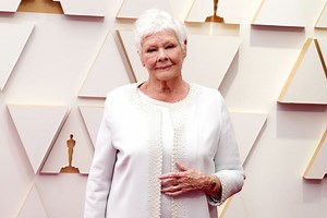 Dame Judi Dench wows in white on Oscars red carpet