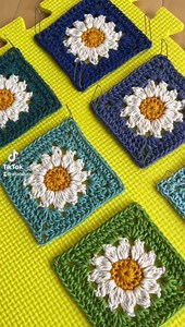 1.4K views · 128 reactions | These are the 22 different color combinations I crocheted using all the 24/7 Cotton shades in my stash! It was a lot of fun seeing how they all looked with the daisy center. Which color will you use for your Summer Days Daisy Bag? All the color names can be found in my blog post! Free crochet pattern: https://www.allaboutami.com/summer-days-daisy-bag/ | All About Ami | Facebook