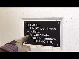 Cleaning a pit toilet