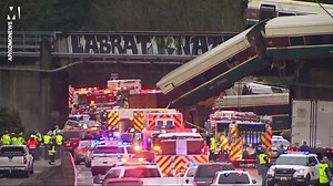 Multiple fatalies as train derails off bridge onto busy highway at 80mph