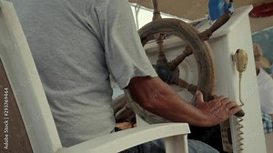 Close Up Steering Wheel On Sea Trips And Adventures Vessel.Captain Turning Steering Wheel Floating Boat.Ship Floating Sea.Captain Turns Wooden Steering Wheel On A Ship.Steering Wheel Of Pleasure Boat.