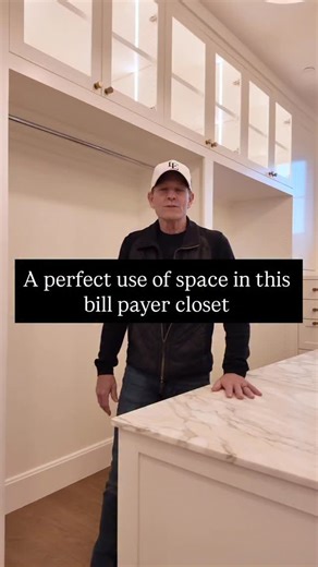 LE Construction LLC on Instagram: "A large center island with storage, a full makeup vanity, endless hanging and shoe space, and upper glass cabinetry designed to showcase purse collections beautifully. And tucked discreetly behind a pocket door? A stackable washer & dryer—because luxury should also be effortless. #leconstructionllc #luxuryhomes #customhomes #closet #hercloset"