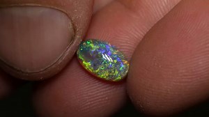 8.4K views · 452 reactions | A gorgeous dark crystal opal with vivid flashes of green, gold and blue play of color across the face of the gem ⚡️ It would look magical in a ring setting ✨️ 1.94ct crystal opal 10.9×6.8×4.2mm https://blackopaldirect.com/product/opal/crystal-opal/1-94-ct-crystal-opal-10-9x6-8x4-2mm/ | Black Opal Direct | Facebook