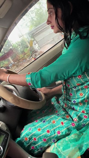 Driving in Style: Traditional Dress and Rainy Views