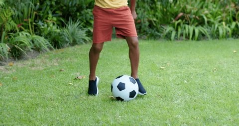 clip-4008575883-child-shifting-nudging-soccer-ball-bending-lift