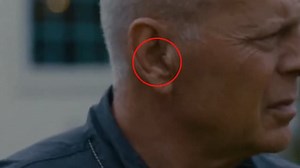 Bruce Willis wearing an ear piece in 2021 film, 'American Siege'
