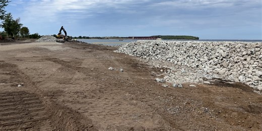 Construction ongoing for a new rock revetment Marquette shoreline