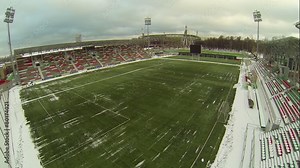 Soccer stadiums with empty tribunes and grass field Stock Video