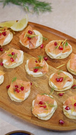 Little Helps Festive Smoked Salmon Blinis 🎉🐟 Ingredients 📝: 170g Plain Flour 1 tsp Fast-Action Dried Yeast 250ml Fresh Milk – Lukewarm 1 Medium Egg – Lightly Beaten 125g Finest Irish Cream Cheese 1 tbsp Finest Horseradish Sauce 200g Ready-to-Eat Smoked Salmon Slices 1 Lime – Zest and a Squeeze of Juice Fresh Dill – To Garnish Freshly Ground Black Pepper – To Season Handful of Pomegranate Seeds – To Finish Method 🧑‍🍳: 1. In a large bowl, mix the flour, yeast, and a pinch of salt. Make a well