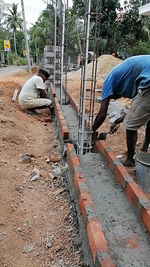 🧱🔗 Rowlock Brick Laying for Tie Beam Formwork🔗🧱 Skilled masonry in action! The rowlock brickwork acts as a permanent formwork for the upcoming reinforced concrete tie beam, laid precisely on top of the random rubble masonry of the front boundary wall. This method saves time, material, and adds stability! 🏗️🔧 Smart, efficient & structurally sound! 💪 #RowlockBrickwork #TieBeamSupport #PermanentFormwork #BoundaryWallConstruction #CivilEngineering #MasonryDetail #PiumalPathirana #EngPiumalPat