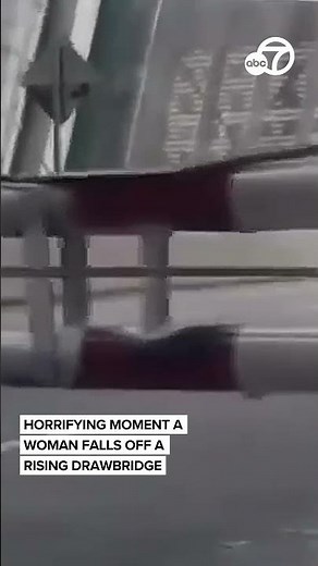 Horrifying moment a woman falls off a rising drawbridge