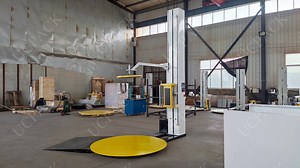 [Hot Item] Automatic Pallet Pre-Stretch Film Pallet Stretch Wrapper Machine with Pneumatic Operated Top Presser