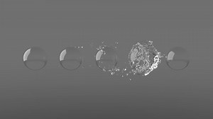 clip-1052901674-water-orb-envelops-glass-spheres-beautifully-wraps