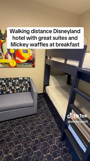 We love the SpringHill Suites Anaheim Resort & Convention Center! The hotel has big suites that are perfect for the whole family. This is a great hotel that is about a 12 minute walk to the parks. Some of the rooms have super fun bunk beds. Each room has a pull out sofa bed and mini kitchens with microwaves and fridges to make it easy to prep simple meals. The hotel also offers complimentary hot breakfast every morning with Mickey waffles! We love the heated rooftop pool and big deck with views