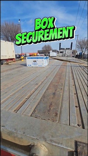 Box securement to a flatbed trailer