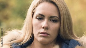 Sad woman looking at camera, feels insecure and depressed, disappointed in life