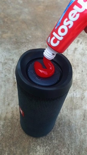 Red closeup JBL bass test on speaker