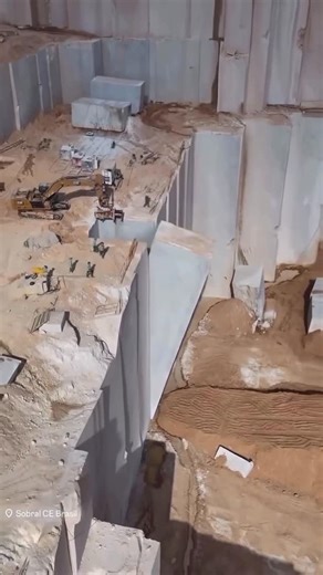 MODERN ARCHITECT on Instagram: "The genesis of enduring architecture is found deep within the rugged landscape of the earth. ⛰️ In the quarries of Sobral, #Brazil, massive vertical sections of white stone are cleaved from the mountain and toppled by gravity. 💫 These raw monoliths expose the pristine texture and structural density of the material before it is refined for surface applications. 🏛️ Observe the monumental scale of extraction required to source natural stone. 🏗