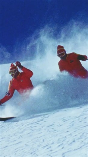 Warren Miller Entertainment on Instagram: "Waist-deep snow, bluebird skies, and a couple friends who don’t mind getting buried—does it really get any better? ❄️ Plus, those vintage kits are just the cherry on top  ️: 1974’s “The Colors of Skiing” We are still traveling around the country on our “SNO-CIETY” film tour! Get your tickets now through the link in our bio. #WarrenMiller #Outside"
