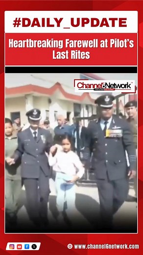 A deeply emotional scene unfolded as family members, including his young daughter, bid a final goodbye during the last rites of the Tejas pilot. The ceremony was marked with full military honors, with officers standing in solidarity to support the grieving family. The moment captured the nation’s sorrow and respect for the brave officer who lost his life in the line of duty. 📌 Disclaimer: This caption is based on publicly available information and does not identify anyone seen in the image. Vis