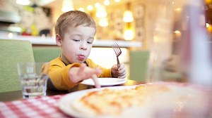 Boy eating breakfast in a cafe - Free Stock Video