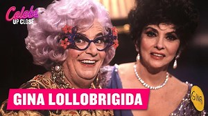 Dame Edna Probes Gina Lollobrigida on Her Heated Love Scene! Gina Lollobrigida coyly recounts a sexy movie scene where she and her co-star got carried away despite the director's attempts to stop them. | Celebs Up Close