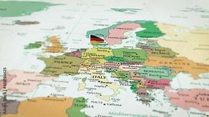 Animation video of Germany on the map and approaching its flag. Shot of the red Germany flag with a waving star in focus in high resolution. Which has borders and neighboring countries.