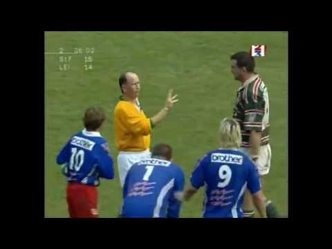 Martin Johnson strikes Christophe Juillet in the face