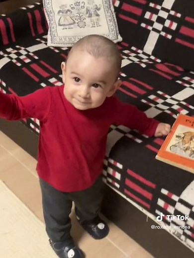 Toddler Exploring Room with Toys and Books
