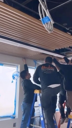 Cory Wasmus on Instagram: "Working with our install partners , Techtown, in Glendale, California. Our acoustical linear wood ceiling panels with concealed C hanger attachment is an excellent solution for wide spanning ceilings. It works with a standard 15/16 ceiling grid system. The planks are white oak rift, 10 per panel with a standard black acoustical backing."