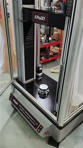 Customized electronic universal testing machine with protective cover. #testmachine
