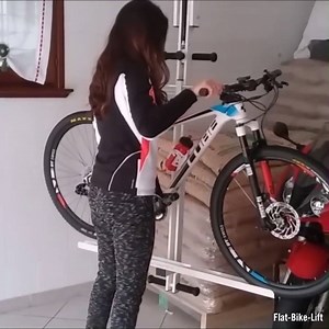 This hydro-pneumatic rack lets you store your bike on the ceiling | Interesting Engineering