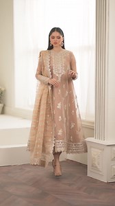 Embracing tradition in this gorgeous peach hued ensemble with golden accents and delicate iconic patterns embroidered on rich and premium masoori oozes ultimate gloss, making it appropriate for the upcoming festivities. | Baroque Fashion
