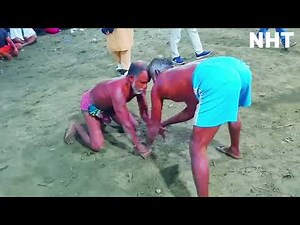 Village wrestling match between two old men