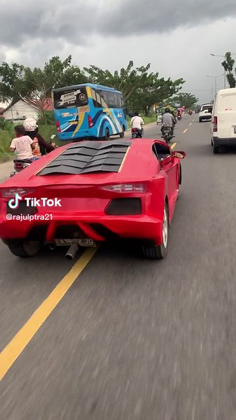 Sleek Red Sports Car Driving Showcase