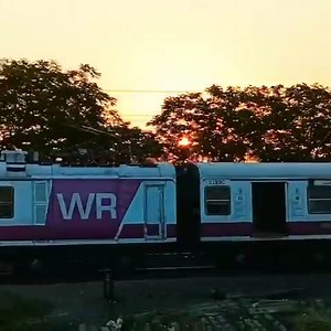 Enticing views of sunrise are indeed heart-warming! Witness splendid view of daybreak as a EMU speeds its way atop Bhayandar Bridge on the suburban section of Western Railway. | Ministry of Railways, Government of India
