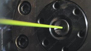 Plant for the production of the cable. Covering the copper cable with an insulating material. Close-up