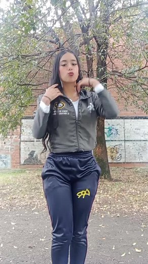 Dynamic Outdoor Dance Performance in Stylish Tracksuit