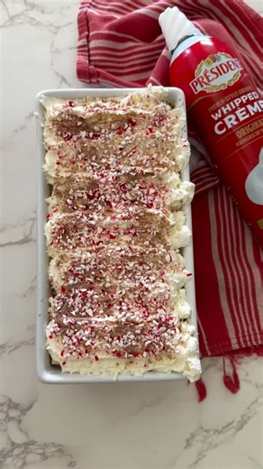 Jacqueline Vignona | Easy & Delicious Recipes on Instagram: "Candy Cane Ice Box Cake Looking for an easy holiday dessert that feels impressive but takes almost no effort, this candy cane icebox cake is it. I’m using @presidentcheese Original Whipped Crème because it’s already perfectly whipped, light, and ultra-creamy, which makes layering this dessert so simple—no mixer required. Layer chocolate wafer cookies with the whipped crème, dust with hot chocolate powder and crushed peppermint, and rep