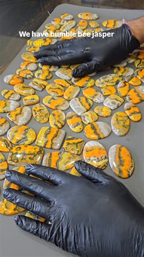 Labradorite King 👑 on Instagram: "What do we have today? Bumblebee Jasper from Indonesia. Those bold yellow bands come from sulfur-rich minerals, the fiery orange tones are formed by realgar & orpiment, and the soft white areas are calcite — all layered together by volcanic activity. Not a true jasper, but a rare volcanic mineral stone with some of the most dramatic natural colour contrasts you’ll see. Every pattern is natural. Every piece is one of a kind. #bumblebeejasper #gemshop"