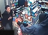 Shocking moment cashier confronts armed robber with her own knife