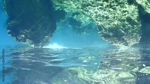 absurd abstract scenery underwater sun rays and beams waves on rocks upside down footage ocean scenery strange backgrounds